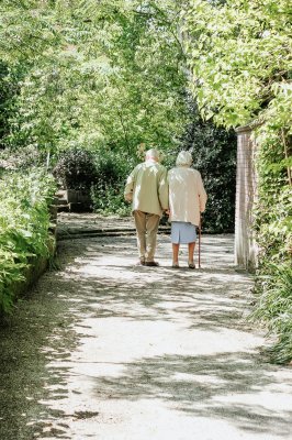 two elderly people going on a walk